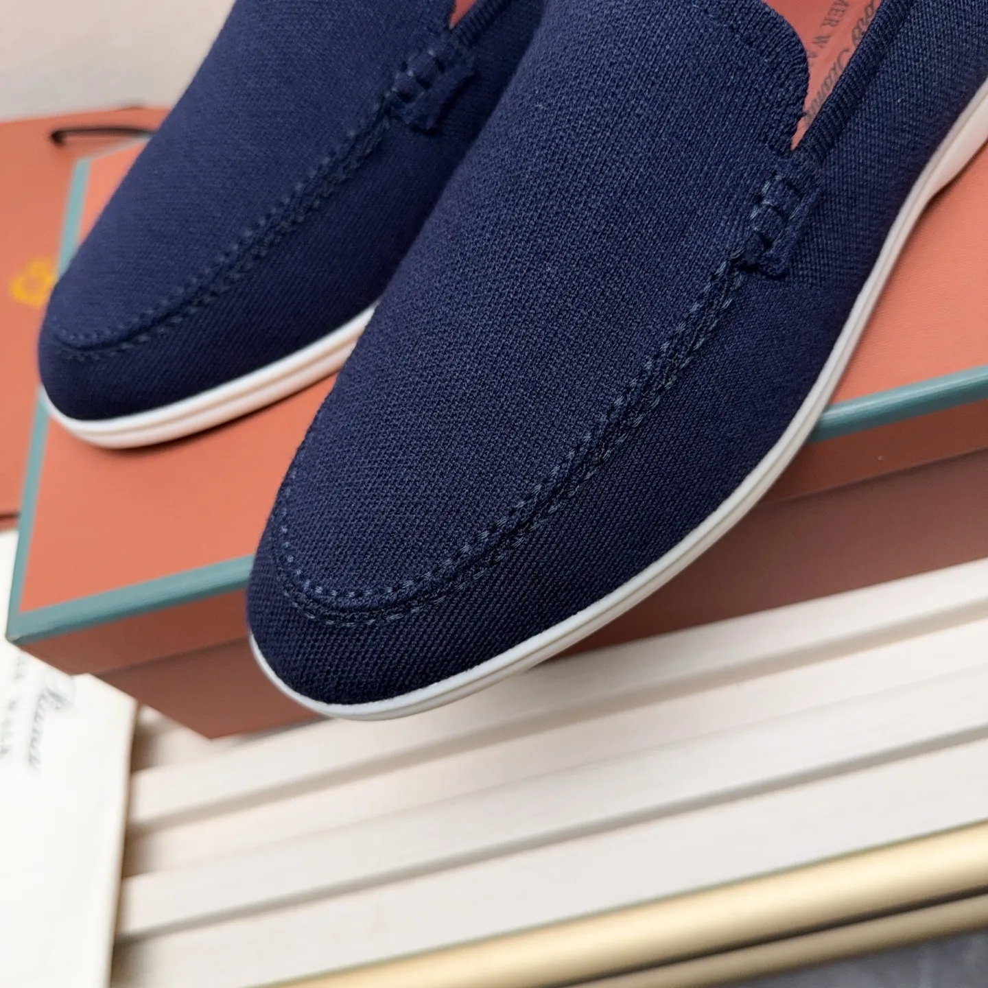 Men's Men's Shoes 💰400 Loro PIana moccasins are made of wish wool fabric. The upper is made of knitted fabric, made on a loom, and then attached to a rubber sole. The Rain System's water-repellent treatment enhances the shoe's functional design, while the suede details give the shoe a sense of elegance and sophistication. Made from Wish, fine wool from Australian and New Zealand Merino sheep